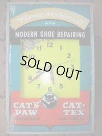 1950'S CAT'S PAW ADVERTISING LIGHTED SIGN CLOCK